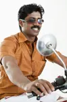 south-indian-man-riding-motorcycle-close-up-36256114.jpg