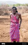 maasai-man-smiling-wearing-traditional-attire-in-maasai-mara-national-reserve-ke.jpg